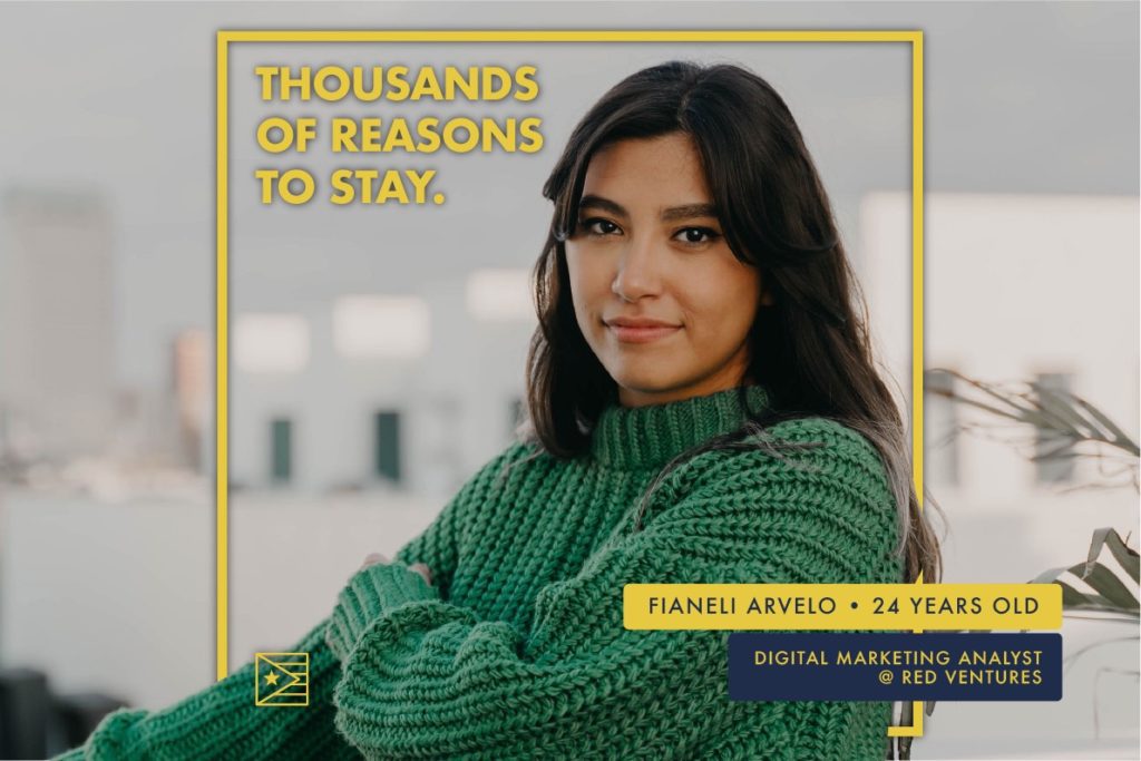 Fianeli Arvelo, 24 years old digital marketing analyst at Red Ventures,  sitting with a green sweater